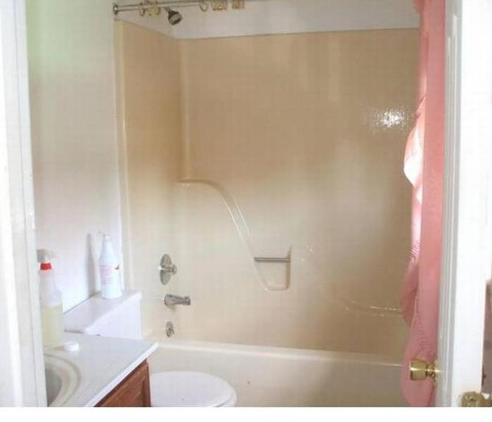 built in tub in bathroom cream color with no visible mold